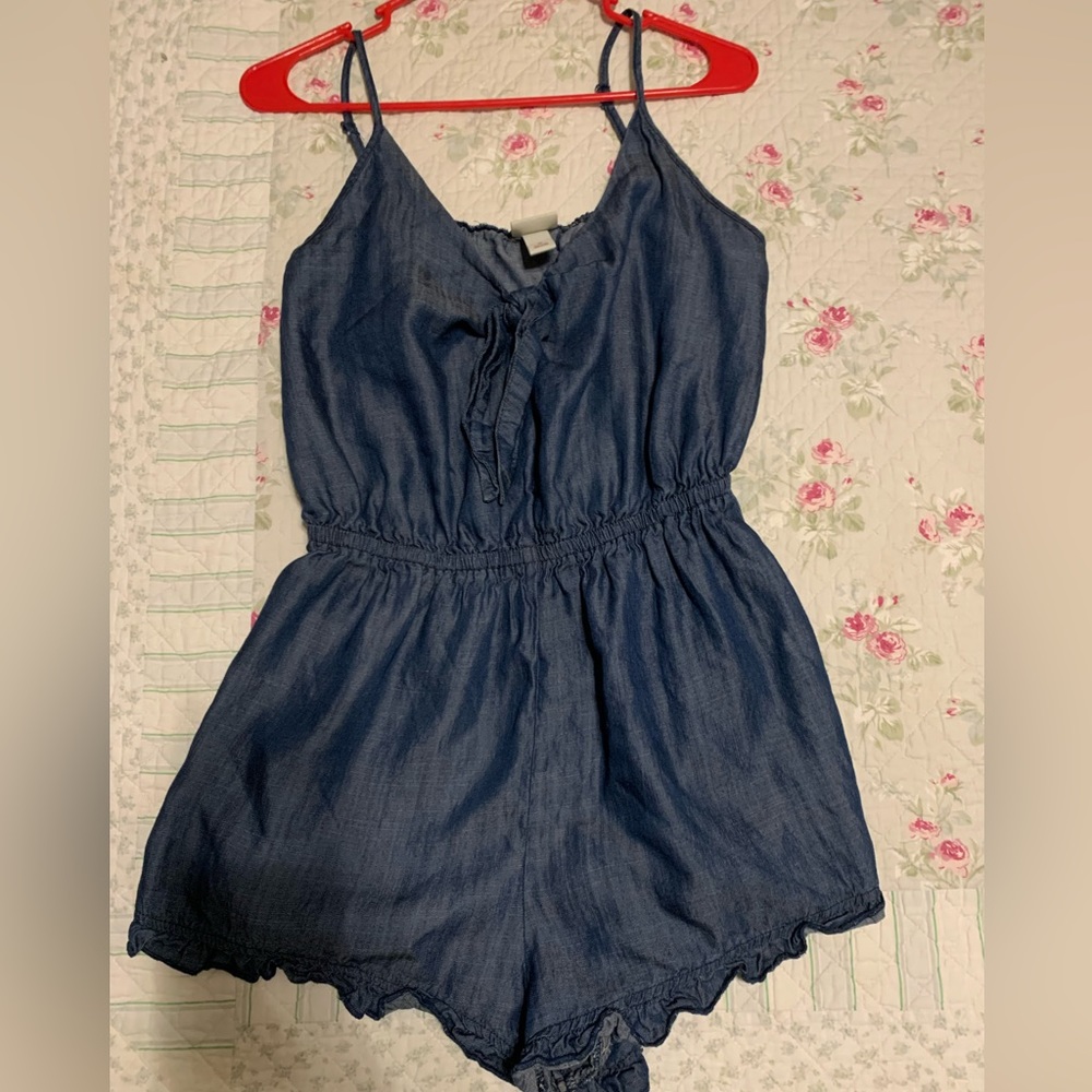 Cute dark denim ruffle romper.